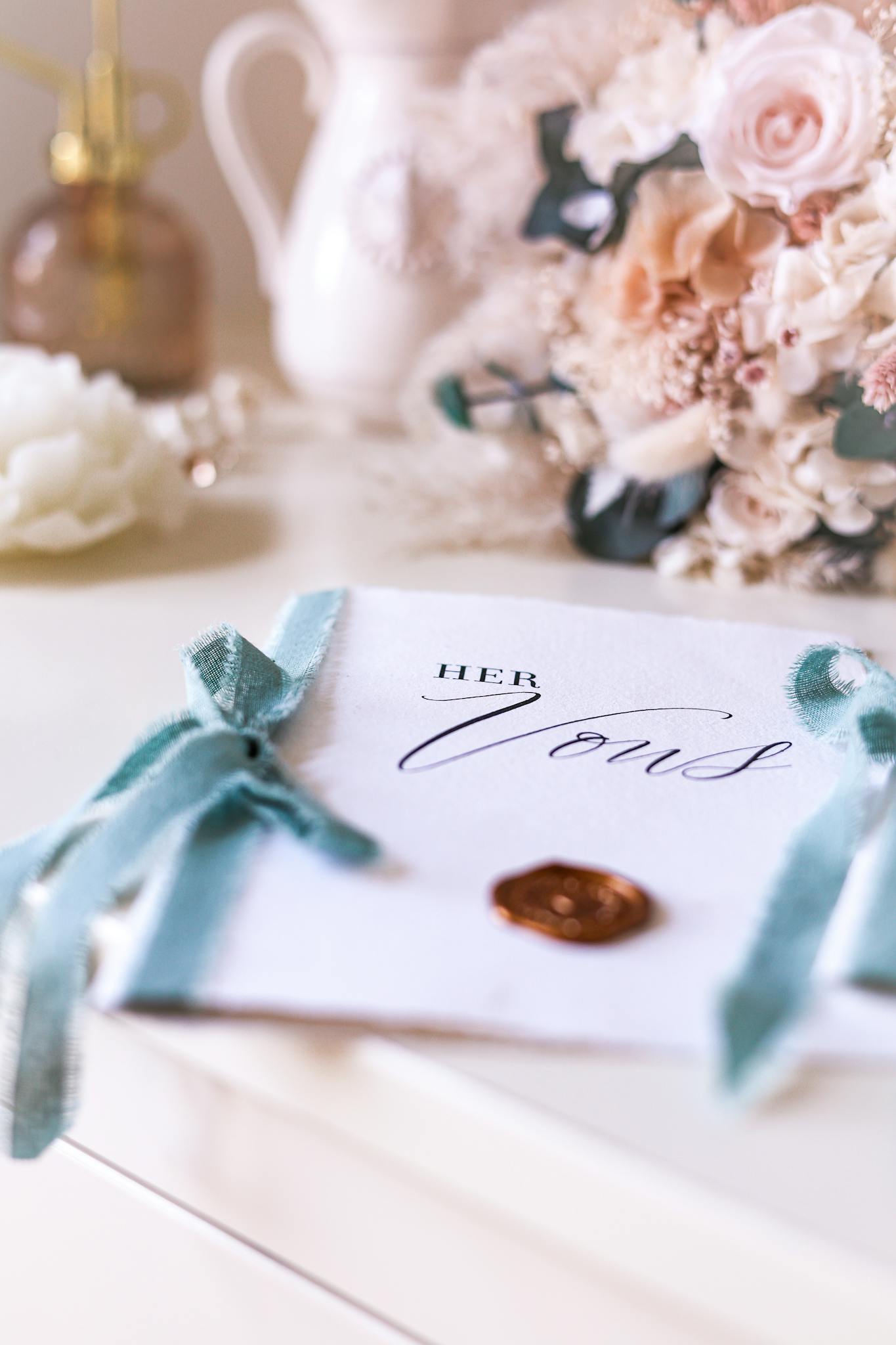 A stylish wedding vows booklet adorned with flowers, perfect for capturing wedding moments.